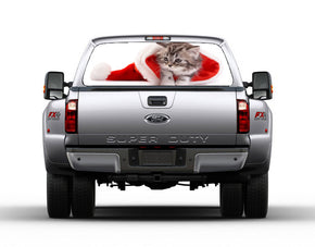 Fenêtre arrière de voiture de chat de Noël voir-à travers le décalque net
